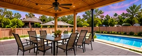 Covered patio with dining set beside a pool at a portfolio home